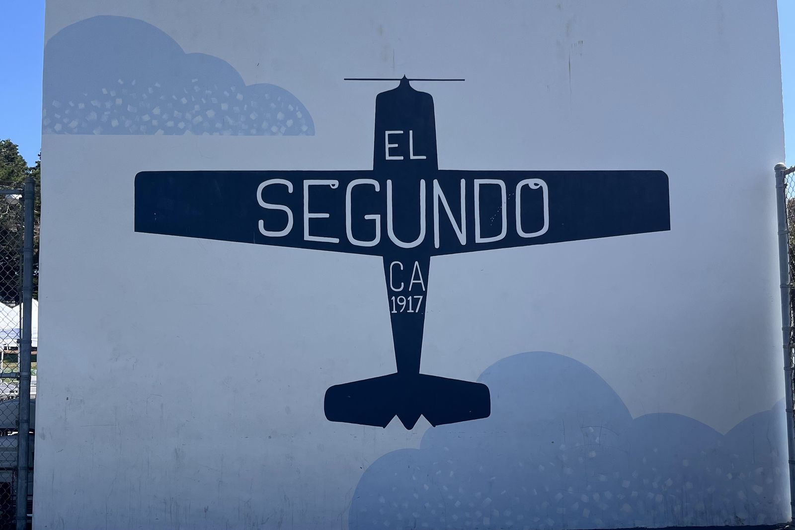 The El Segundo mural at Recreation Park, a small aeroplane painted above the town name.